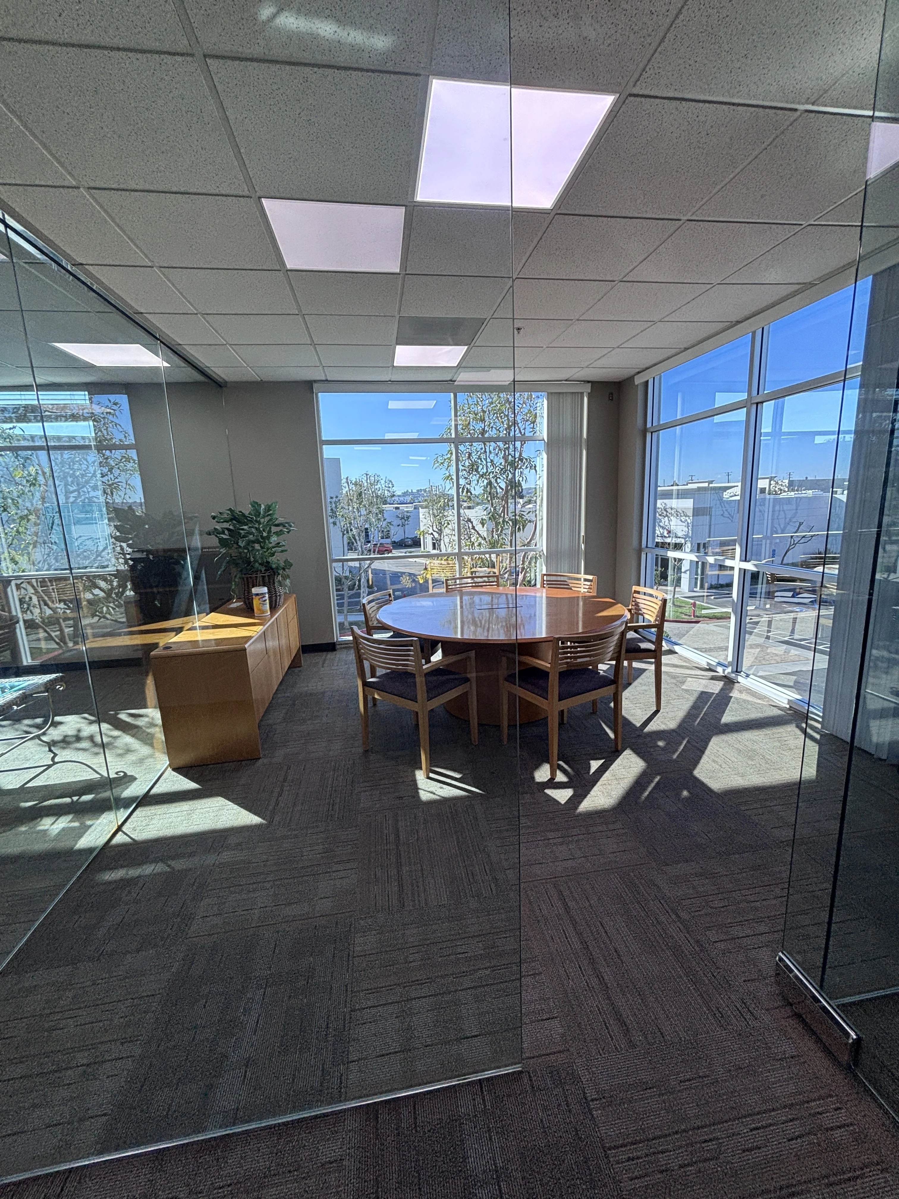 Professional cleaning team following a Norwalk office cleaning schedule in a modern workplace.